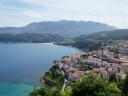 Spectacular elevated view of a town descending a hillside in front of the sea