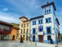 Colorful historic buildings with wooden balconies in a town square