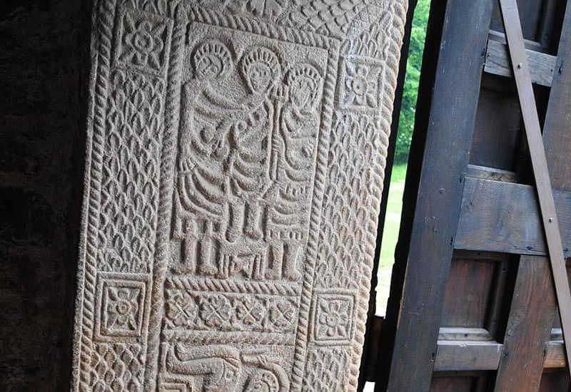 Pre-Romanesque relief of the jamb of San Miguel de Lillo, with its geometrically carved scene designs.