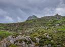 Summit of Paisano or Muñián peak with antenna and cloudy sky