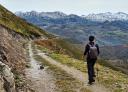 Path between hillsides with views of the Picos de Europa