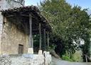 Stone chapel with centenary yew tree in Fresnedo