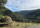 Viewpoint with wooden fences and mountains and vegetation in the background