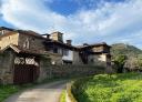 Stone farmhouse with traditional architecture in a natural setting