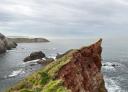 View of impressive cliffs and sheer cliffs emerging from the sea.