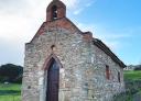 Stone hermitage with bell tower and roof