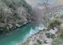 Aerial view of the river squeezed between rocky walls with turquoise water