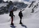 Two hikers walk on snowshoes in Vegarredonda