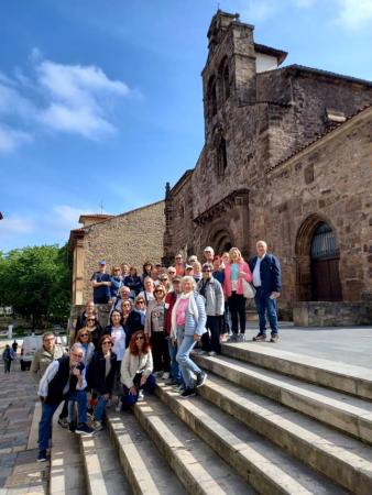 Group on a guided tour of a historic church in Asturias