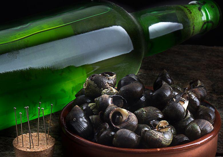 Image of bottle of cider and plate of periwinkles