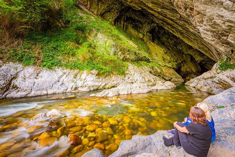 Photo of people sitting in the Deboyu Cave