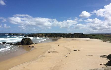 Surfing at Penarronda Beach